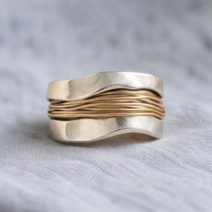 Silver ring with golden threads